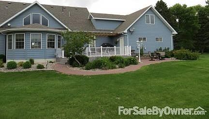 Back view
						:
						Large perennial garden and firepit