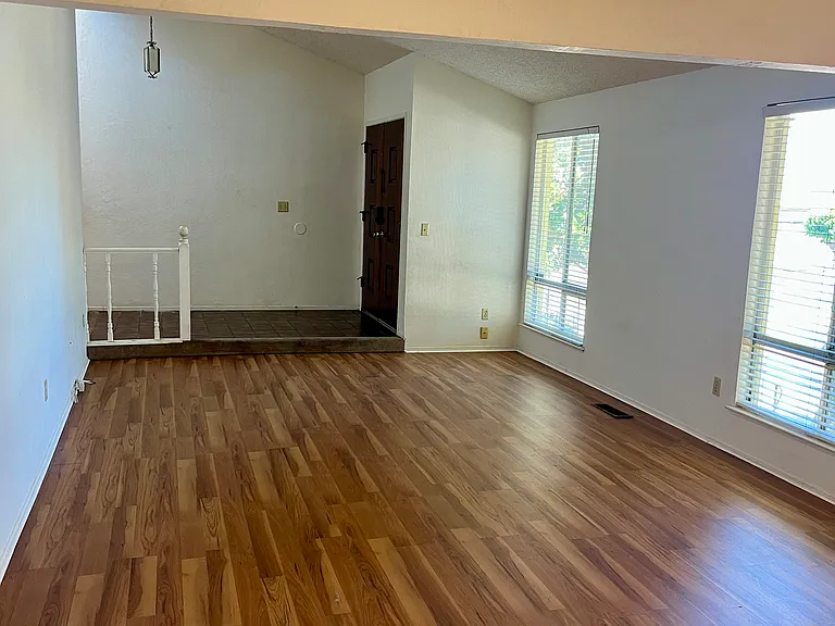 Living and dining rooms, entrance, and hallway.