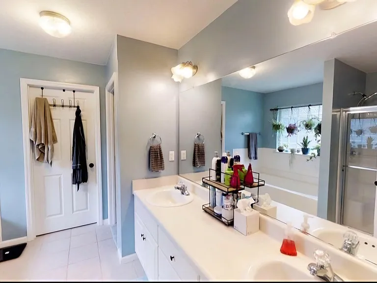 Bathroom has been painted and new counter top, mirrors and faucets installed. Will have current photo soon.