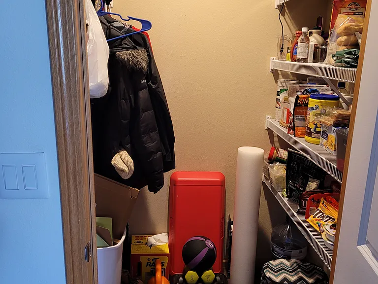 Kitchen pantry/coat closet.