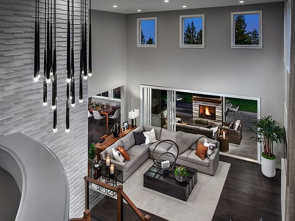 Soaring two-story ceiling floods the family room with light