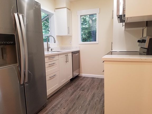 Stainless Steel appliances in all newly updated kitchen. New cabinets & quartz counter-tops!