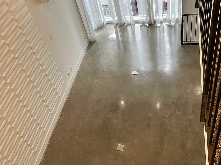 Looking down from 4th Floor hallway into main living room & feature wall