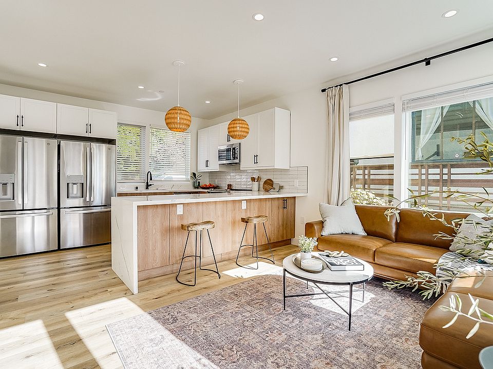 Spacious living room and kitchen with natural light