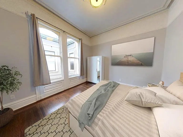 Bed 2-This image shows a virtually furnished space. Bedrooms come unfurnished.