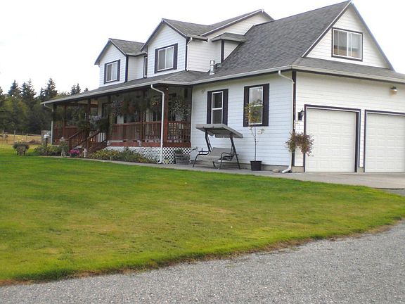 Side view from drive way 3 car garage