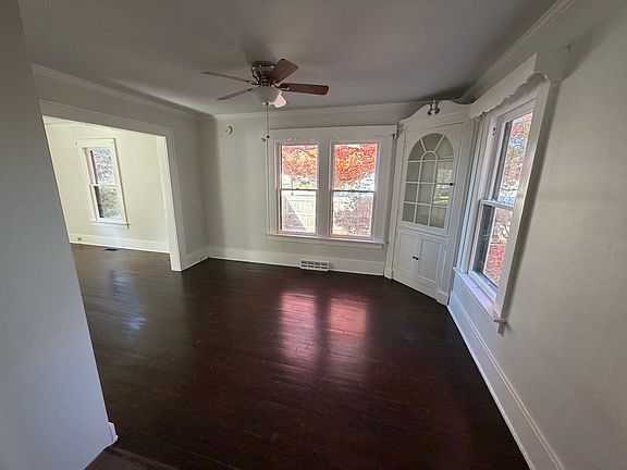 Dining area is spacious and has windows and built ins for storage