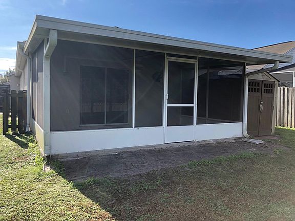 Screened in back porch and storage shed!