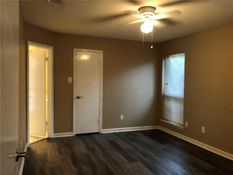 Spacious primary bedroom with walk-in closet and en suite bathroom.