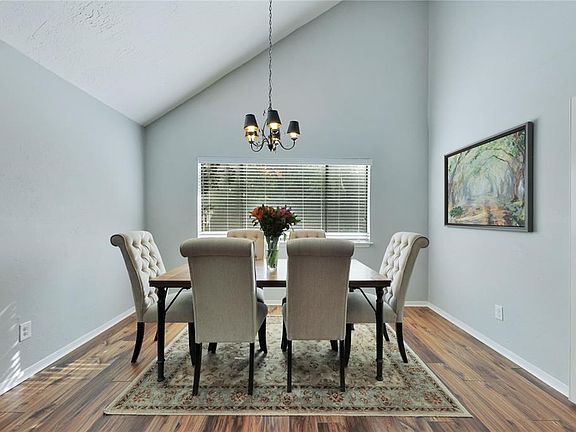 Dining room flows through a doorway into the kitchen for easy serving !