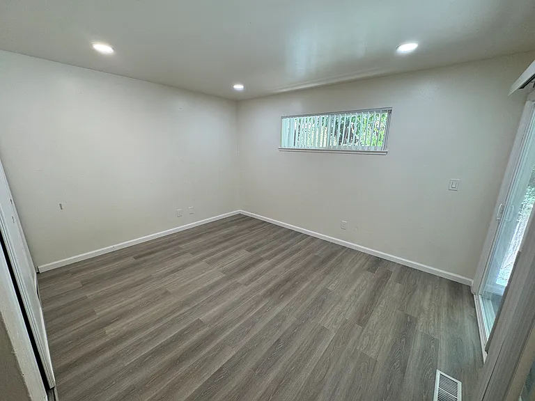 Bedroom 2 with patio access.