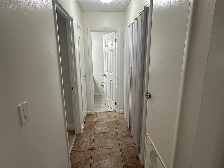 View bedroom 2 corridor access from kitchen.