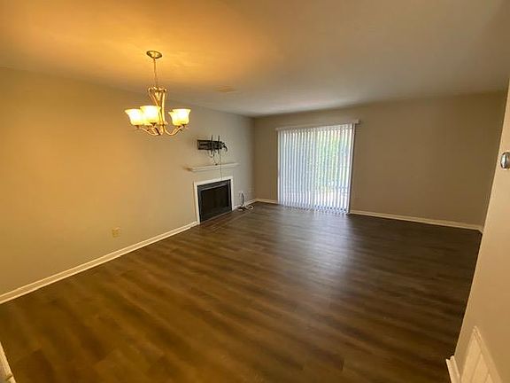 Family Room and dining area with brand new LVP floors and fresh paint.