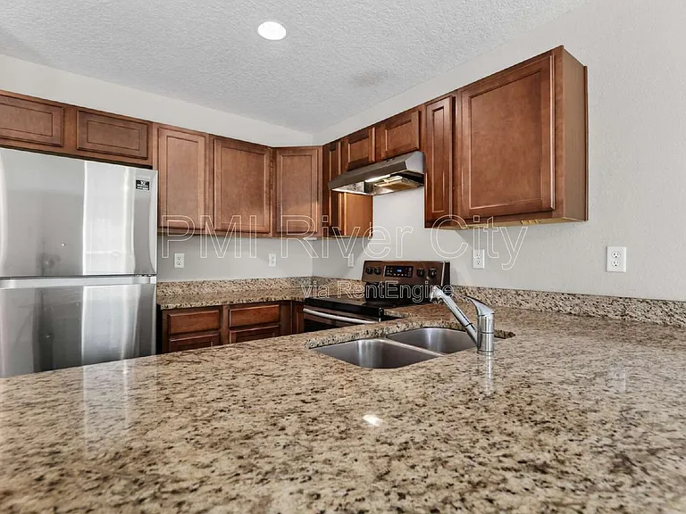 7608 Rain Forest Dr N — Photo 2