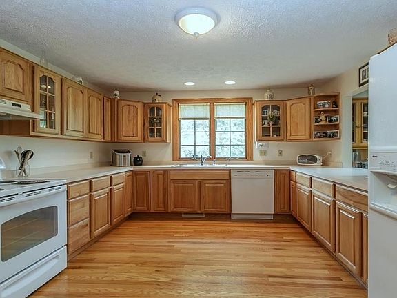 HUGE, CUSTOM KITCHEN, HICKORY CABINETS AND HARDWOOD FLOOR.
