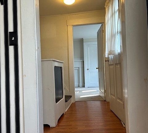 hallway fro the kitchen, entrance door