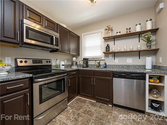 Updated stainless steel appliances in kitchen