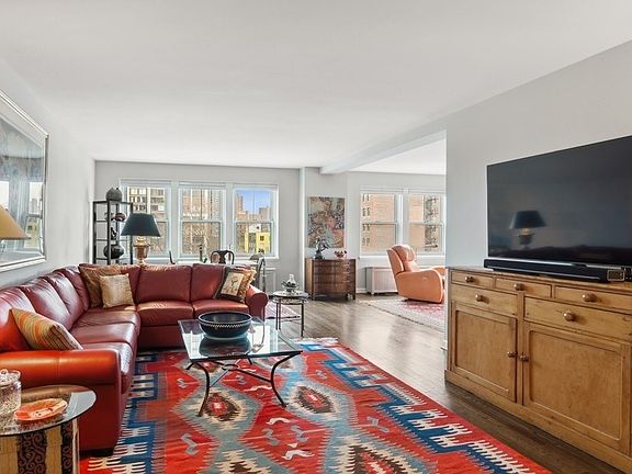 The oversized living room is used here as a dining