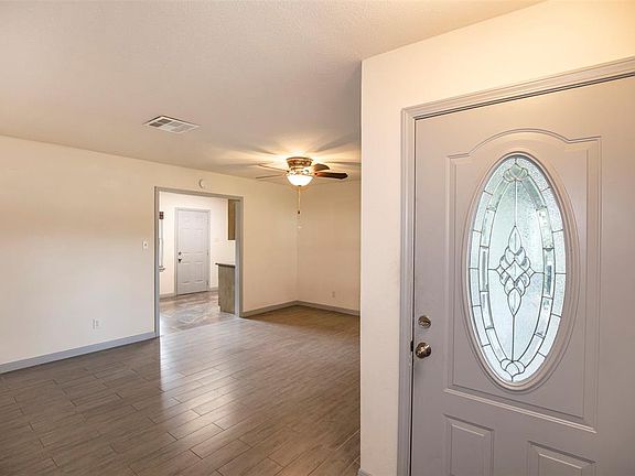 As you enter the home through the front door that boasts a beautiful leaded glass design, you are welcomed with fantastic flooring and spacious family room.