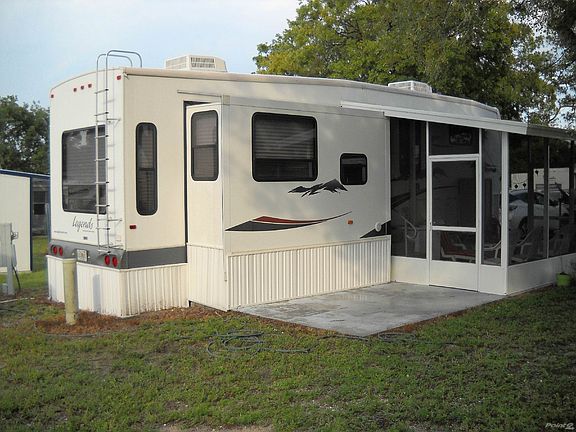 view of side with patio and sun porch
