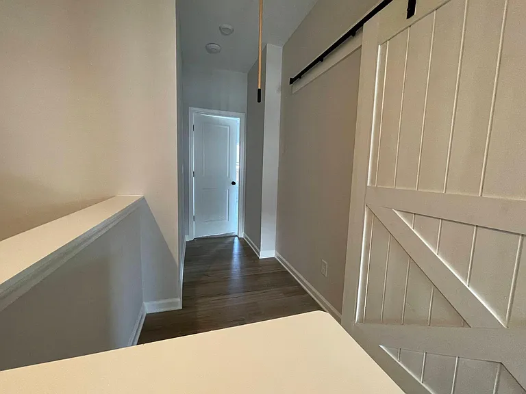 Master Bedroom Hallway showing Laundry room Barn Door