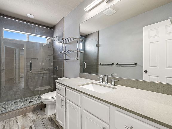 Fully remodeled common bathroom with large walk in shower