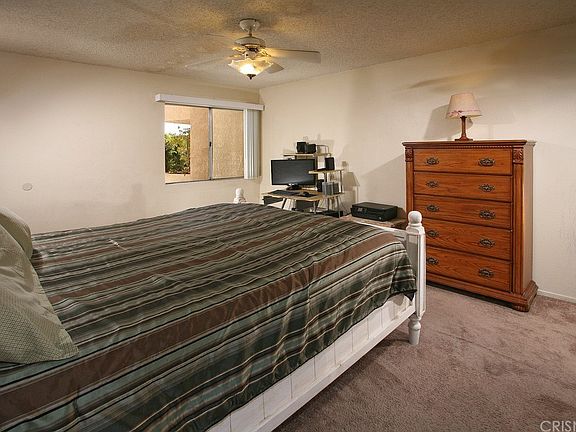 The spacious master suite is bathed in natural lig