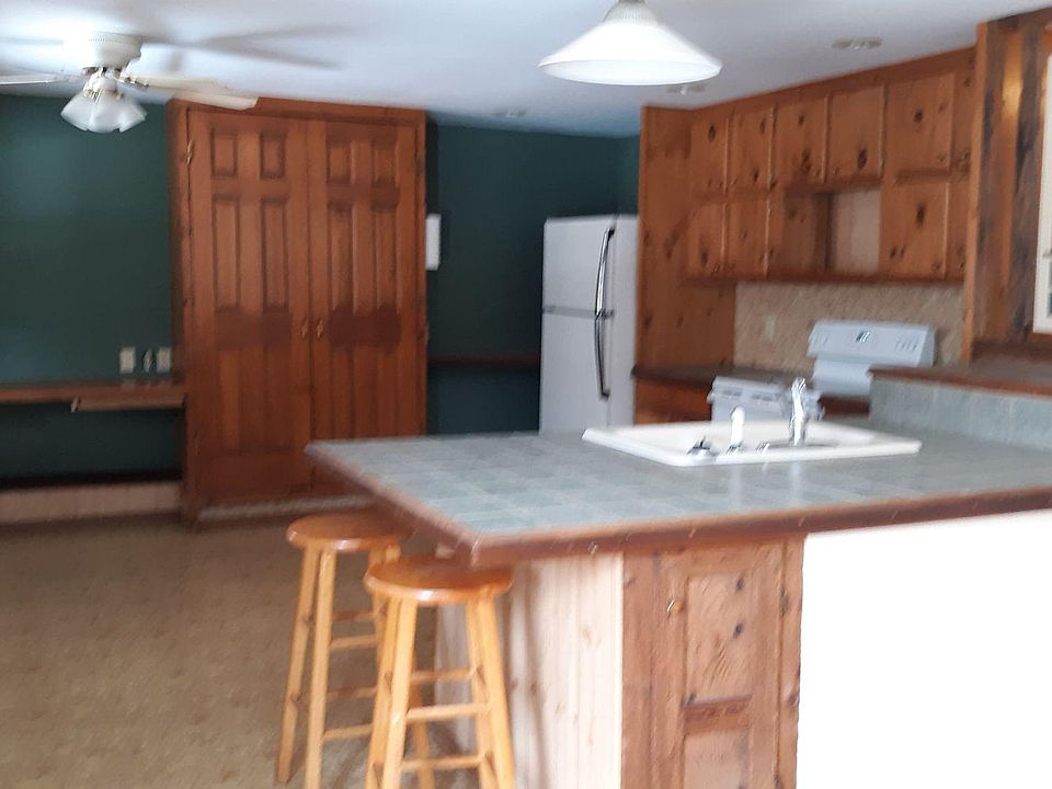 Kitchen with pantry center and desk on left