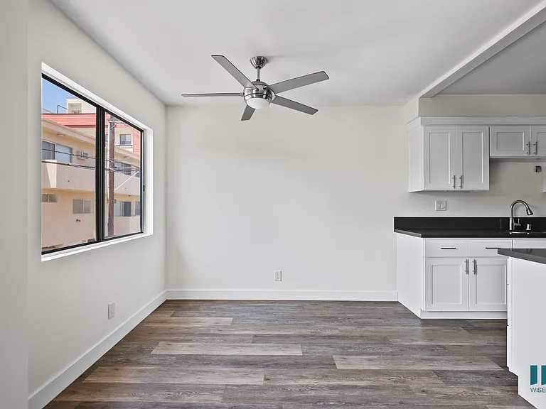Dining Room with Large-Size Windows and Vinyl Flooring