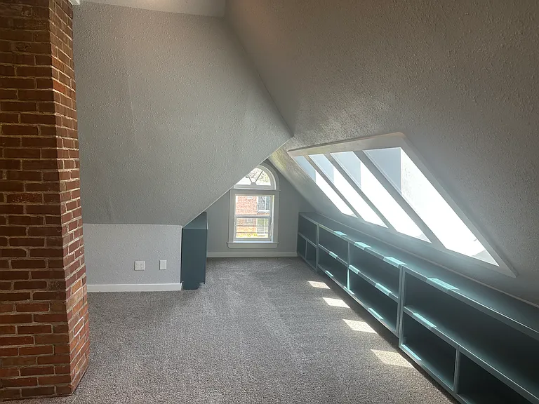 Bedroom 3 or flex room, large space built in storage, lots of natural light. Previously used as a bedroom & art studio.