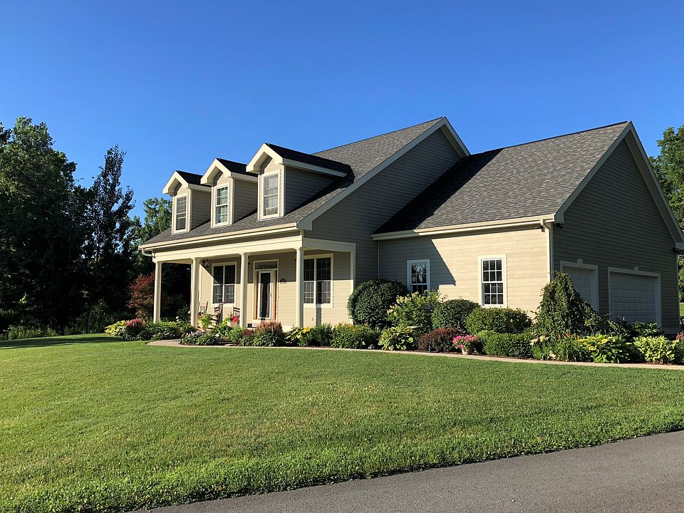 Beautifully landscaped
Craftsman style cape on a cul-de-sac
