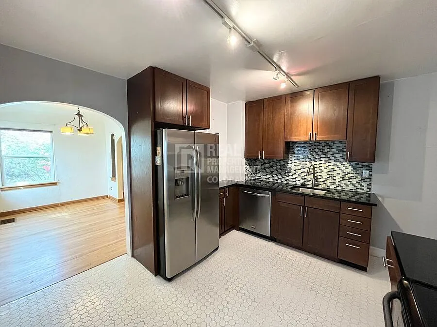 Charming 3-Bedroom Denver Home with Sunroom & Attached Garage — Photo 4