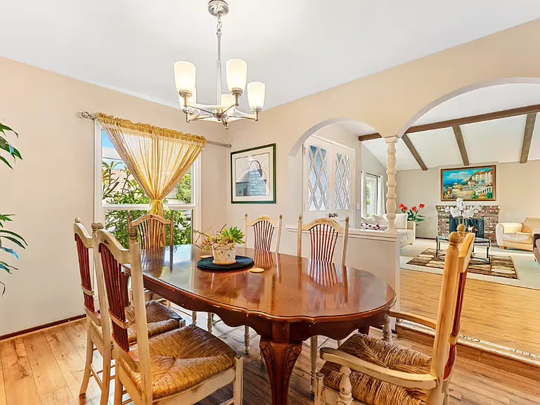 Thisformal dining room picture shows it is adjacent to the living room and entrance door. The street can also be viewed from this room.