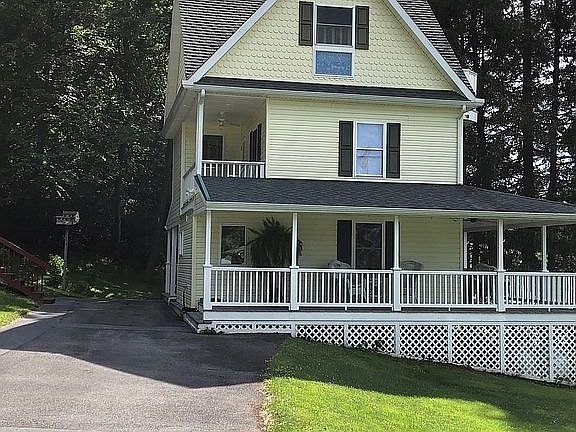 Paved parking behind House 