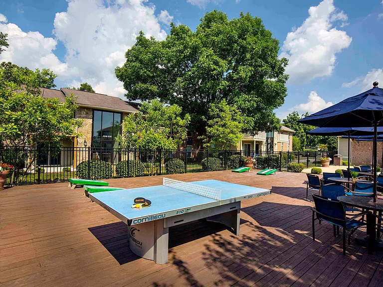 Outdoor recreation space with ping pong and cornhole