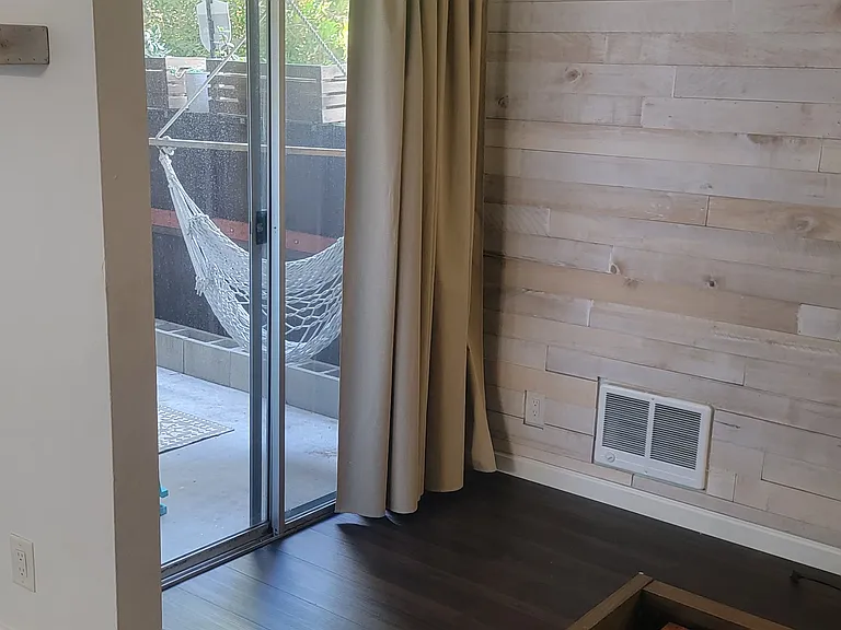 The patio is visible and accessible from every room, including dual access from both the bedroom and living room and feels feels like a natural extension of the home bringing the outdoors in