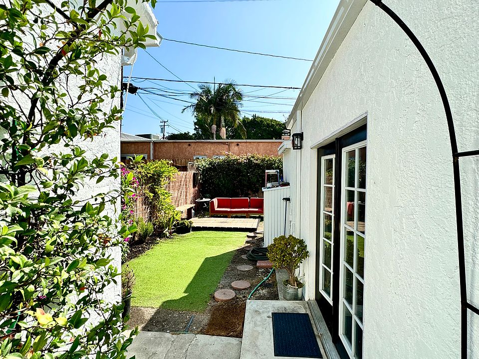 Entrance to private yard for guesthouse. Guesthouse entrance through French doors on right.