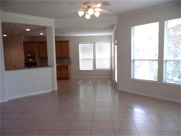 Gorgeous den with tile floors.  This area is perfect for entertaining.