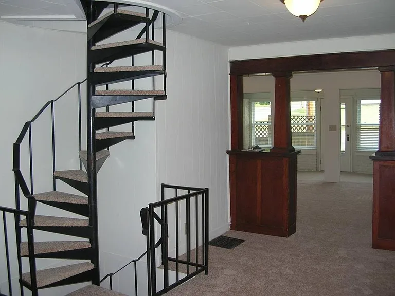 Spiral stairs lead to the loft or basement