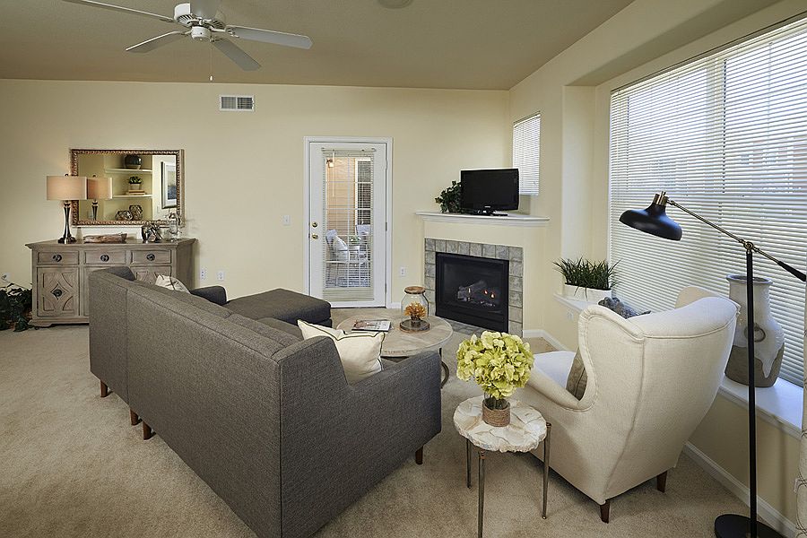 Ceiling fans and gas fireplaces in living room