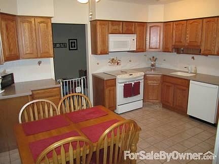 Kitchen
						:
						Corian counters, newer appliances and oak cabinets