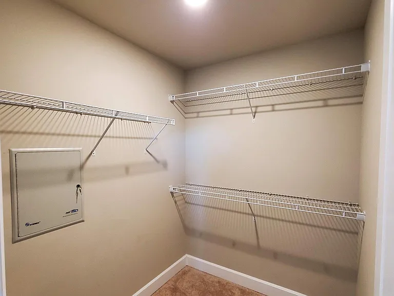 Primary Bedroom walk-in closet