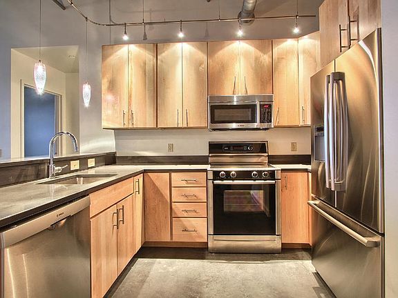 Gorgeous kitchens with hardwood cabinets, Silestone counters, stainless steel appliances, luxurious fixtures, and so much more!