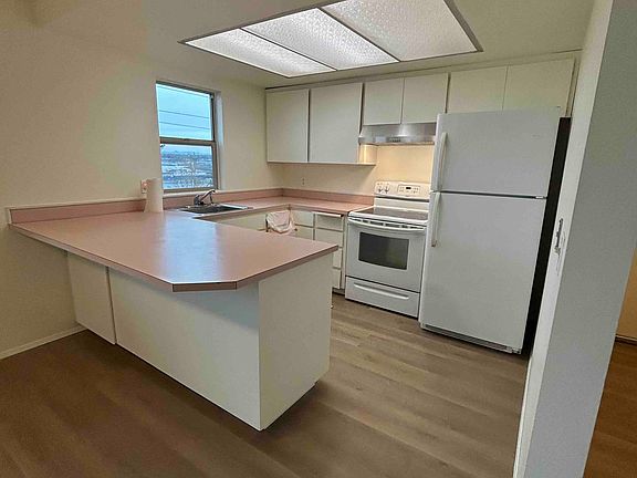 Convenient, well-lit kitchen with bay-view window