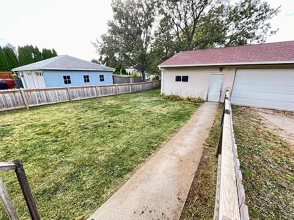 Large fenced-in yard with access to garage.