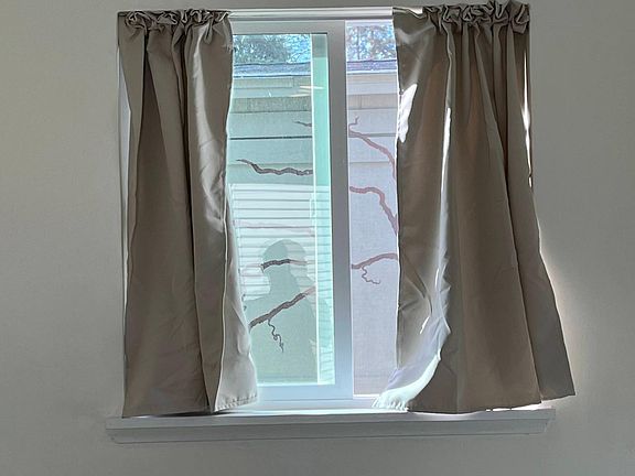Blackout curtains to keep sun heat out and for sleeping