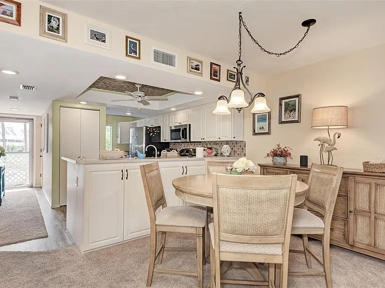 Coastal charm in every detail. _ From the upgraded kitchen view to the curated local art on the walls, we've designed our dining space to be both elegant and inviting. The perfect spot for a quiet dinner or a lively morning breakfast!