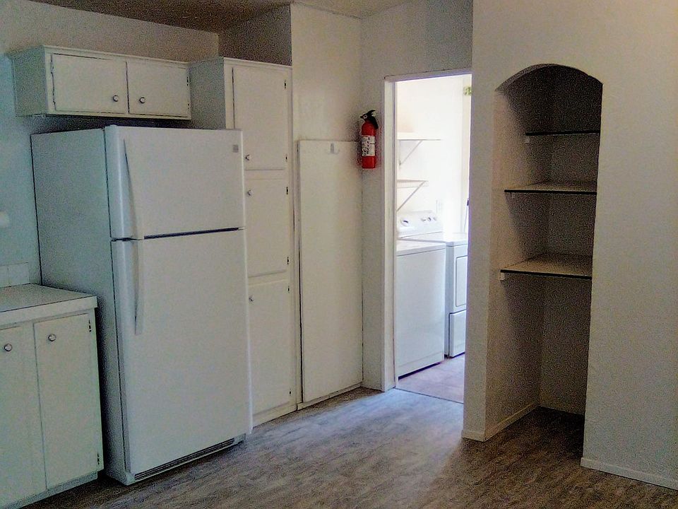Kitchen area over looking the laundry room