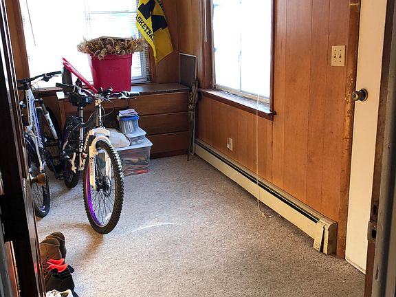 Front foyer as you walk in the door can be porchy or a pleasant reading room or office. It's heated. The desk comes with the house.
