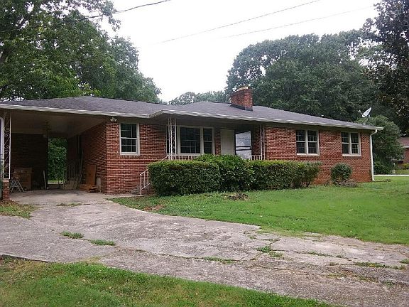 Large carport with lots of exterior lighting.